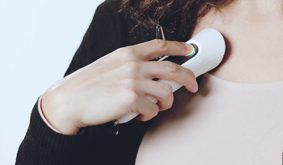 Patient using the original version of the Nonagon device to record chest sounds